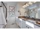 Elegant bathroom with double vanity and walk-in shower at 1165 Sugarloaf Ln, Erie, CO 80516