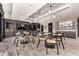 Community room with tables, chairs, and large screen TVs at 1901 Wazee St # 719, Denver, CO 80202