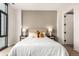 Elegant bedroom with a calm color scheme, featuring a comfortable bed and nightstands at 1901 Wazee St # 719, Denver, CO 80202