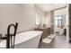 Contemporary bathroom with double vanity and a view into the bedroom at 1901 Wazee St # 719, Denver, CO 80202