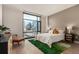 Bright bedroom with city view, featuring a comfortable bed and stylish furniture at 1901 Wazee St # 719, Denver, CO 80202