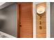 Stylish apartment entry with wood door and modern light fixture at 1901 Wazee St # 719, Denver, CO 80202
