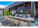 Upscale outdoor kitchen with granite counters, grill, and seating area at 1901 Wazee St # 719, Denver, CO 80202