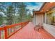 Red deck with a wooden chair and scenic views at 11 Granite Dr, Boulder, CO 80302