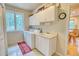 Laundry room with washer, dryer, and a utility sink at 11 Granite Dr, Boulder, CO 80302