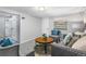 Finished basement features a sitting area with couch and armchairs at 4424 Decatur St, Denver, CO 80211