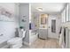 Updated bathroom with patterned tile and modern vanity at 4424 Decatur St, Denver, CO 80211
