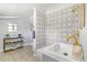 Updated bathroom with patterned tile and modern vanity at 4424 Decatur St, Denver, CO 80211