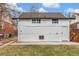 Rear exterior of house showing detached structure and yard at 4424 Decatur St, Denver, CO 80211