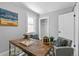 Home office with a wooden desk and comfortable chairs at 4424 Decatur St, Denver, CO 80211