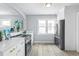 Modern kitchen with stainless steel appliances and ample counter space at 4424 Decatur St, Denver, CO 80211