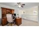 Upstairs office with built-in wooden desk and shelving at 24615 E Arizona Pl, Aurora, CO 80018