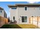 Rear view of the house showing a sliding glass door and AC unit at 5282 Columbine Ln, Denver, CO 80221