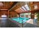 Indoor swimming pool with skylights and wood-paneled walls at 1150 Golden Cir # 205, Golden, CO 80401