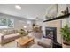 Bright living room features a fireplace and hardwood floors at 2001 Gray St, Edgewater, CO 80214