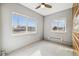 Bedroom with wood paneled wall and ceiling fan at 2001 Gray St, Edgewater, CO 80214