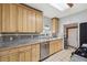 Kitchen with wood cabinets, granite countertops and stainless steel appliances at 2001 Gray St, Edgewater, CO 80214