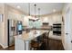 Kitchen with island, stainless steel appliances, and hardwood floors at 1194 W 125Th Dr, Denver, CO 80234