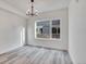 Bright dining room with large window and hardwood floors at 1304 Snowberry Ln # 102, Louisville, CO 80027