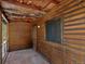 Wooden balcony with log cabin exterior and mountain views at 5525 S Twin Spruce Dr, Evergreen, CO 80439