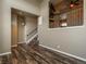 Living room with hardwood floors and access to staircase leading upstairs at 18189 E Saskatoon Pl, Parker, CO 80134