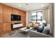 Living room with wood-paneled feature wall and comfy seating at 1980 S Holly St # 2, Denver, CO 80222