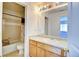 Bathroom with tub, toilet and wood vanity at 7450 Lowell Blvd # A, Westminster, CO 80030