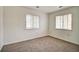 Spacious bedroom with two windows and carpet at 7450 Lowell Blvd # A, Westminster, CO 80030