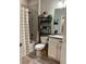 Clean bathroom with white vanity, grey tile, and modern fixtures at 12261 Karls Ln, Northglenn, CO 80241