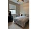 Bright bedroom with a double bed, window coverings, and a small desk at 12261 Karls Ln, Northglenn, CO 80241