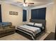 Spacious bedroom with a king-size bed and sitting area at 12261 Karls Ln, Northglenn, CO 80241