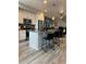 Modern kitchen featuring a large island and stainless steel appliances at 12261 Karls Ln, Northglenn, CO 80241