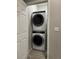 Convenient laundry room with a stacked washer and dryer at 12261 Karls Ln, Northglenn, CO 80241