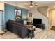 Comfortable living room featuring a sectional sofa and large TV at 12261 Karls Ln, Northglenn, CO 80241