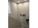 Upstairs hallway with neutral-colored walls and carpeted stairs at 12261 Karls Ln, Northglenn, CO 80241