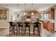 Island kitchen with seating and stainless steel appliances at 1055 Divide View Dr, Golden, CO 80403