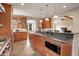 Open kitchen boasting granite countertops and wood cabinetry at 1055 Divide View Dr, Golden, CO 80403