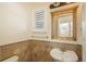 Small bathroom with a pedestal sink, tile flooring, and decorative mirror at 2703 Timberchase Trl, Highlands Ranch, CO 80126