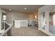 Upstairs hallway with carpet, built-in storage, and access to a balcony at 2703 Timberchase Trl, Highlands Ranch, CO 80126