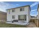 Home's exterior with sliding glass doors and patio at 6645 Dry Fork Dr, Frederick, CO 80516
