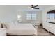 Spacious bedroom with large bed, dresser, and TV at 6645 Dry Fork Dr, Frederick, CO 80516