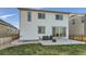 Back exterior view of house with patio and yard at 6645 Dry Fork Dr, Frederick, CO 80516