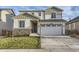 Two-story home with a large garage and stone accents at 6645 Dry Fork Dr, Frederick, CO 80516