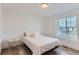 Bright bedroom with a comfortable bed and large window at 6645 Dry Fork Dr, Frederick, CO 80516