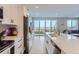 Modern kitchen with stainless steel appliances and backyard view at 6645 Dry Fork Dr, Frederick, CO 80516