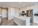 Modern kitchen features a large island and stainless steel appliances at 6645 Dry Fork Dr, Frederick, CO 80516