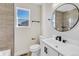 Updated bathroom with modern vanity, fixtures, and tile at 1755 E 96Th Way, Thornton, CO 80229