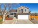 Two-story house with a double garage at 1755 E 96Th Way, Thornton, CO 80229