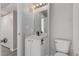 Simple bathroom with white vanity and toilet at 1670 S Deframe St # C1, Lakewood, CO 80228