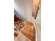 Elegant curved staircase with hardwood treads and railing at 14248 E Hampden Ave, Aurora, CO 80014